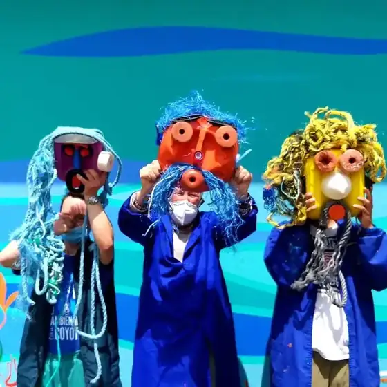 Community art workshop with recycled masks